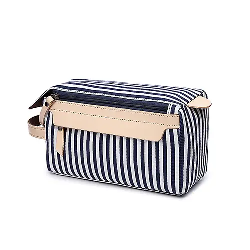 Custom striped waxed canvas dopp kit in nautical travel style for premium lifestyle brands